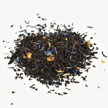 A small pile of Earl Grey’s Anatomy Loose Leaf Tea ☕ with blue and yellow flower petals and orange pieces, displayed on a white background.